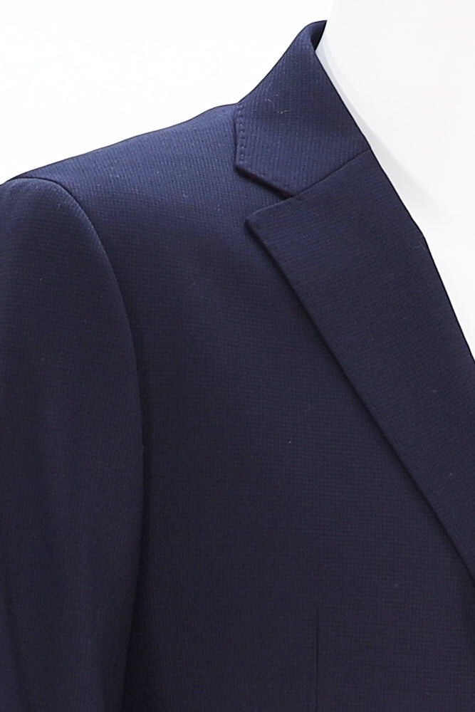 Close-up of lapel and pocket square detail on 7 Downie St. Navy Sports Coat